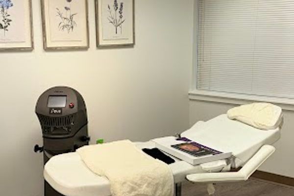Clean, professional medical spa treatment room with neutral tones at ZEM Aesthetics & Med Spa in Charlotte
